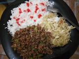 A picture of Steamed rice served with minced meat and steamed cabbage.