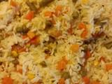 A picture of Rice with mix vegetables.