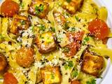 A picture of Fettuccine Aglio e Olio with Cherry Tomatoes and Halloumi Cubes.