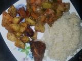 A picture of Veggie mix, roast potatoes and chicken with rice.