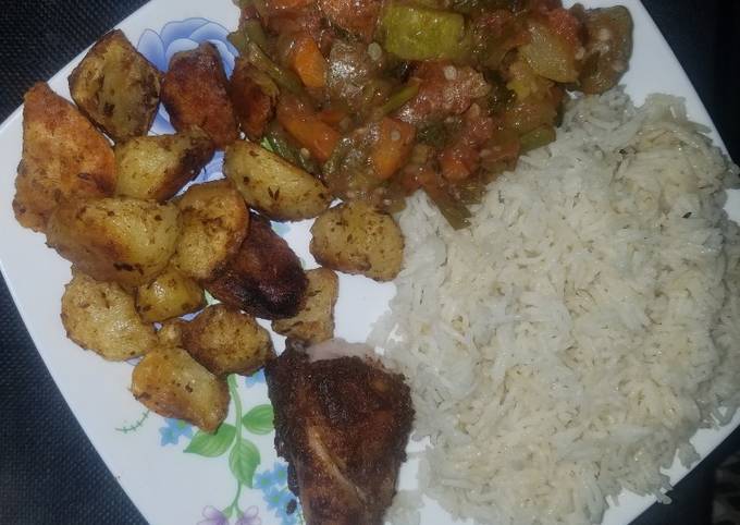 A picture of Veggie mix, roast potatoes and chicken with rice.