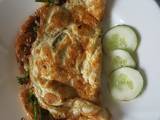 A picture of Omelette Stuffed With Onions & Broccoli.