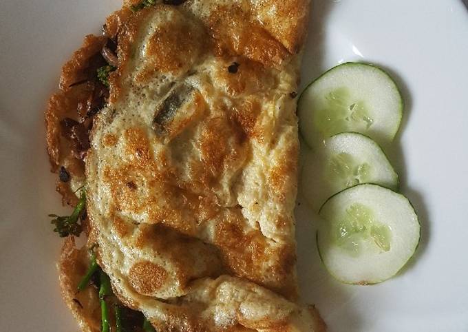 A picture of Omelette Stuffed With Onions & Broccoli.