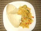 A picture of Ugali with cabbages with veg.