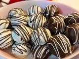 A picture of Gluten Free~ Almond and Cocoa Truffles covered in Vanilla or Milk Chocolate.