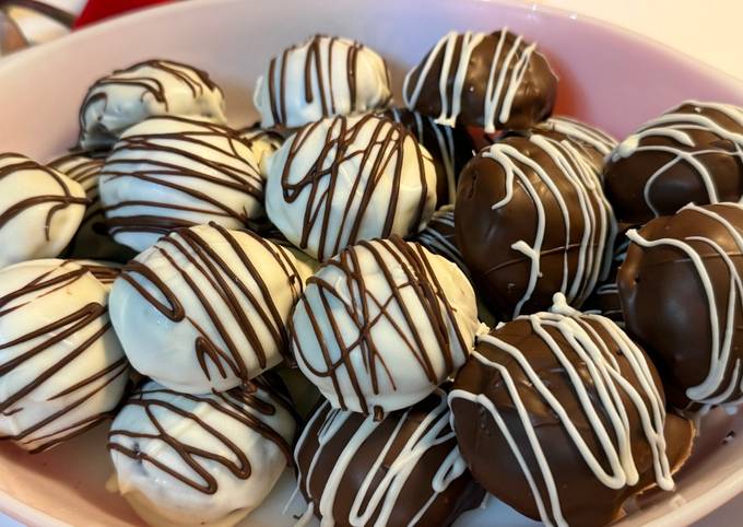 A picture of Gluten Free~ Almond and Cocoa Truffles covered in Vanilla or Milk Chocolate.