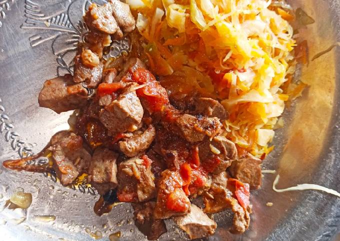 A picture of Simple steamed cabbages alongside fried liver.