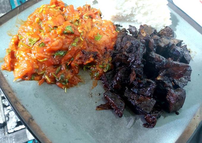 A picture of Sauteed liver with tomato stew.