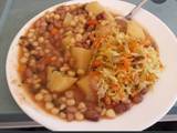 A picture of Githeri mixed with cabbage carrot and potatoes.