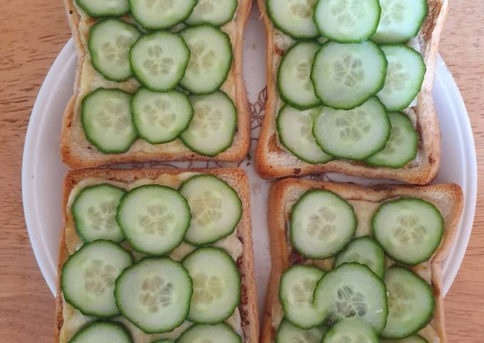 A picture of Cheese on Toast with Cucumber.