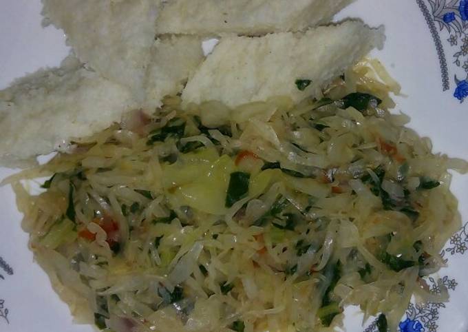 A picture of Ugali cabbage and spinach.