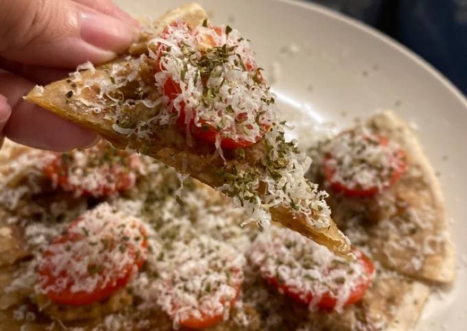 A picture of Emergency hors d’oeuvre - chapati with duck rillettes and tomato.