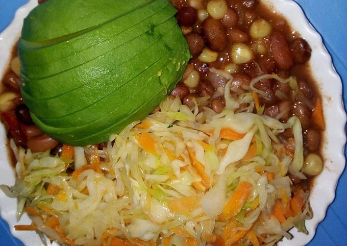 A picture of Stewed githeri with steamed cabbage.