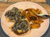 A picture of Open Burgers with mushroom sauce & fries.