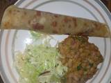 A picture of Chapati served with yellow beans and steamed cabbages.