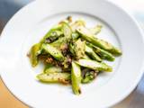 A picture of Sauteed asparagus with anchovies.