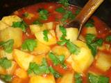 A picture of Potatoes in tomatoes soup.