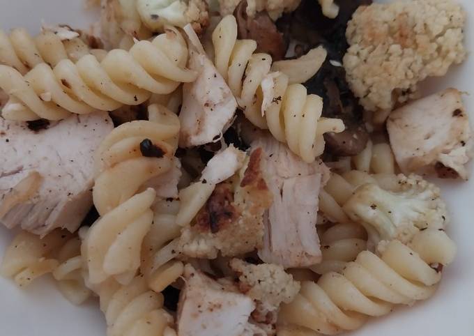 A picture of Sig's roast chicken, roast cauliflower, onion and mushroom pasta.