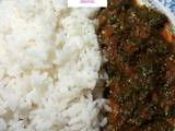 A picture of White rice nd vegetable sauce.