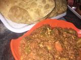 A picture of Fried chappati and vegetable minced meat sauce.