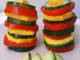 A picture of Tomato Mango Cucumber Salad Towers.