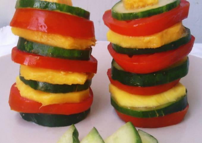 A picture of Tomato Mango Cucumber Salad Towers.