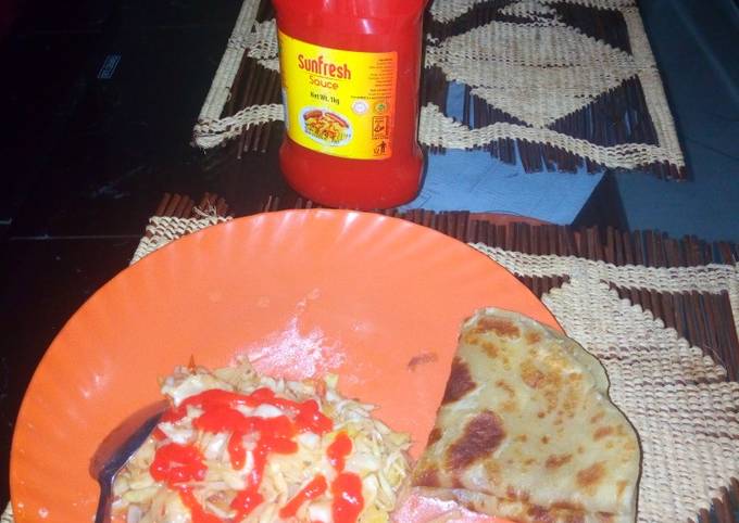 A picture of Homemade Chapatti served with steamed cabbage and sauce.