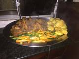 A picture of Kienyeji chicken,roasted potatoes and veggies.