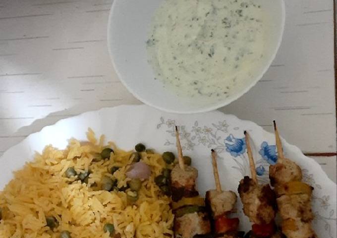 A picture of Chicken Mshkaki/veggie fried rice/yoghurt dip(trial and error)😋.