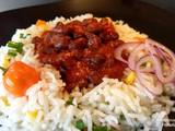 A picture of Njahi with mixed vegetable rice.