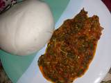 A picture of Pounded yam and vegetable soup.