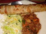 A picture of Chapati served with beef and steamed cabbage.