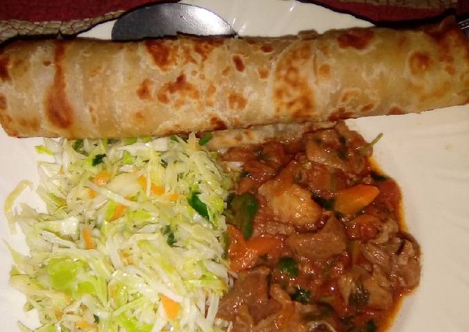 A picture of Chapati served with beef and steamed cabbage.