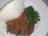 A picture of Fried Omena Sukuma wiki and ugali.