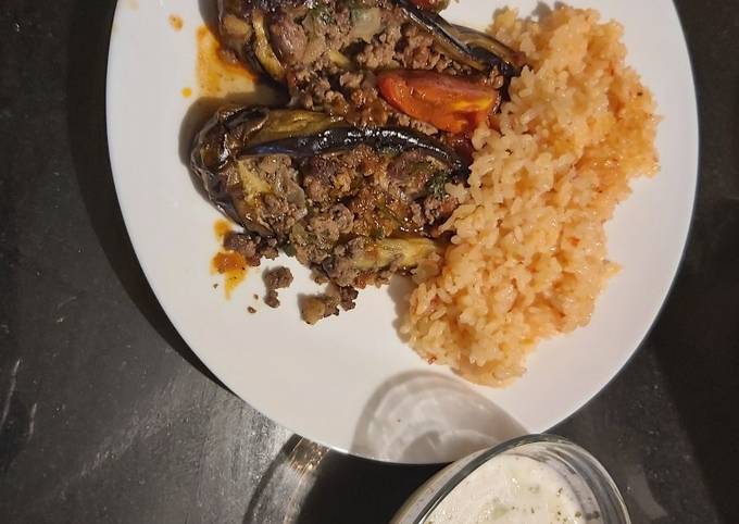 A picture of Tomatoe rice,eggplant with minced meat and cucumber mint yoghurt.