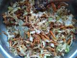 A picture of Sautéed cabbage and carrot with tuna.