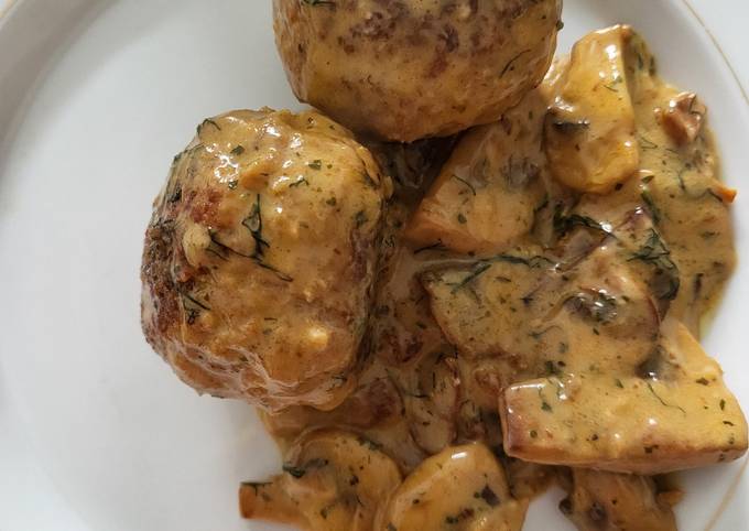 A picture of Meatballs in mushroom cream sauce.