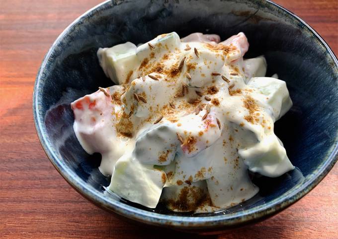 A picture of Cucumber & Tomato Yoghurt Salad with Cumin.