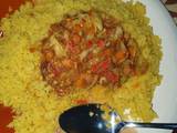 A picture of Fried cous cous with vegetable and shredded beef stew.