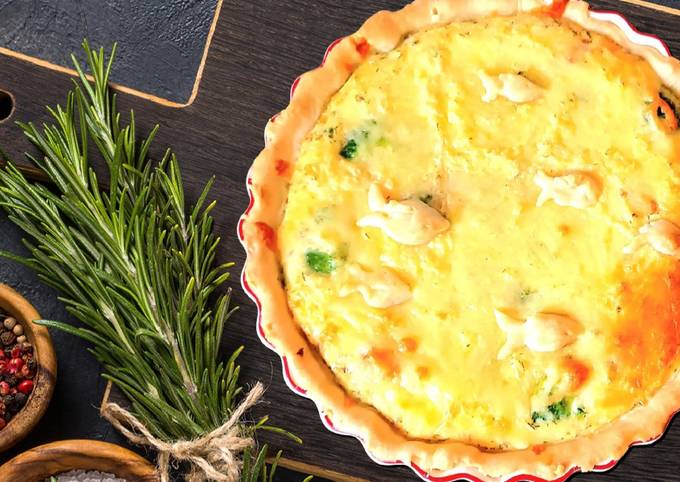 A picture of Pie with broccoli and smoked trout.