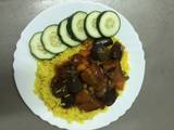 A picture of Turmeric Rice with Eggplant Sauce.