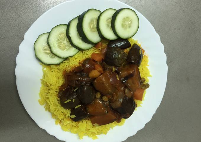 A picture of Turmeric Rice with Eggplant Sauce.