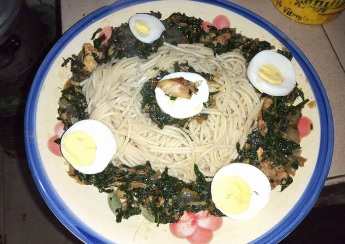 A picture of Spaghetti with vegetables and boiled egg.