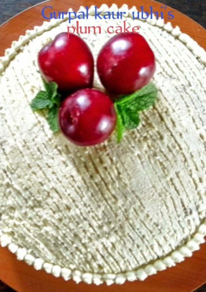 A picture of Plum cake with buttercream.