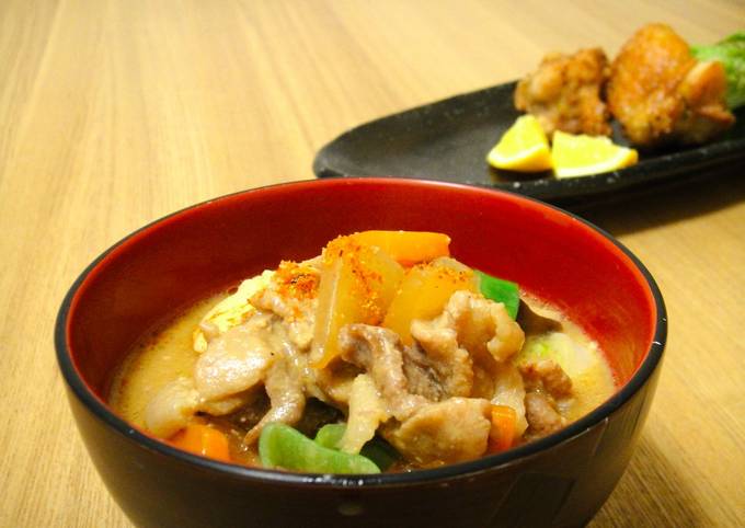 A picture of Tonjiru : A miso based pork soup filled with vegetables.