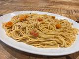 A picture of Mascarpone, tomato and walnuts spaghetti.