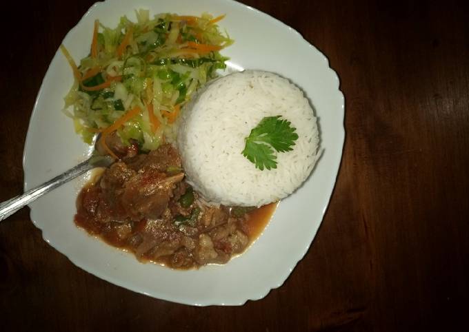 A picture of Rice, beef and cabbage.