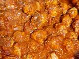 A picture of Meatballs in tomato sauce.