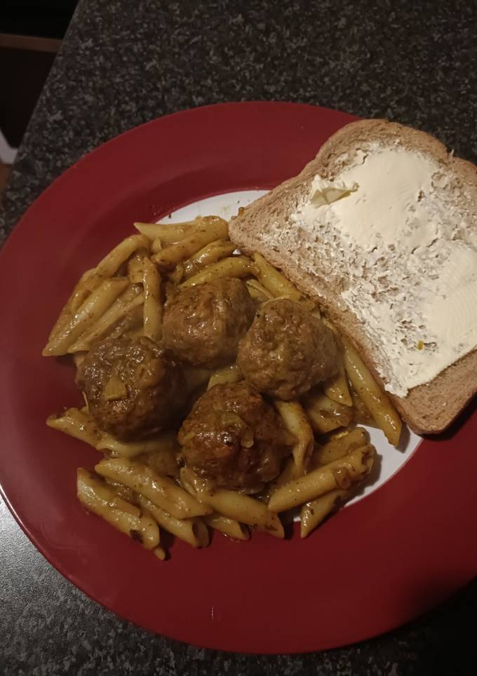 A picture of Turkey Thai curry meatballs with pasta.