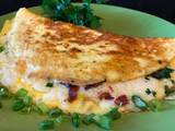 A picture of Omelette with Crispy Bacon, Vegetables and Mozzarella Cheese.